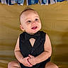 baby, birthday, black_clothing, blue_and_gold, bow_tie, celebration, child, crown, decorations, festive, golden_background, happy, indoors, infant, photography, portrait, royal, sitting, smiling, tuxedo