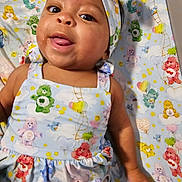 Chyler is registered to the contest to win money with this photo: applique, baby, bed, bodypart, bonnet, clothing, crib, dress, face, finger, furniture, hand, hat, head, infantbed, newborn, pattern, person, photography, portrait