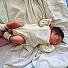 Rafael joined the competition — help win amazing prizes! newborn, baby, sleeping, onesie, blanket, infant, clothing, pink_socks, face, head, skin, person, resting, lying_down, soft_fabric, bed, cozy, cute, peaceful, indoors