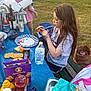 Anthony joined the competition — help win amazing prizes! bench, casual_clothing, child, daylight, drink, face_paint, family, food, girl, grass, outdoor, park, picnic, pizza, snacks, summer, table, toddler, water_bottle, woman