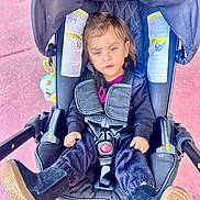 Fernanda joined the competition — help win amazing prizes! baby, car, car_interior, clothing, coat, e_scooter, face, footwear, furniture, head, jacket, jeans, pants, person, photography, portrait, shoe, stroller, transportation, vehicle