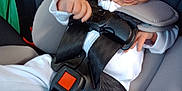 Esther joined the competition — help win amazing prizes! baby, car_seat, child, infant, seat_belt, clothing, white_outfit, straps, safety, car_interior, person, young_child, cute, small_hand, buckle, seat, transportation, car, head, face
