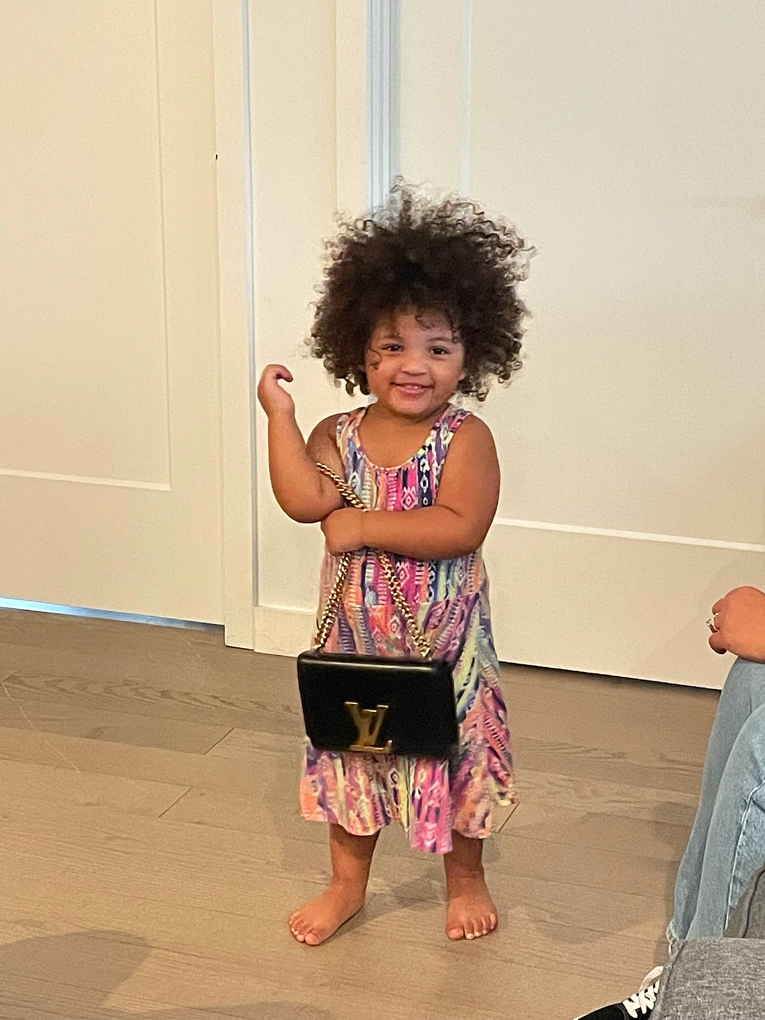 Lailani joined the competition — help win amazing prizes! afro, barefoot, entertainment, event, fashion_design, flooring, foot, gesture, happy, human_leg, joy, magenta, performing_arts, person, sandal, sitting, skin, standing, thigh, toddler