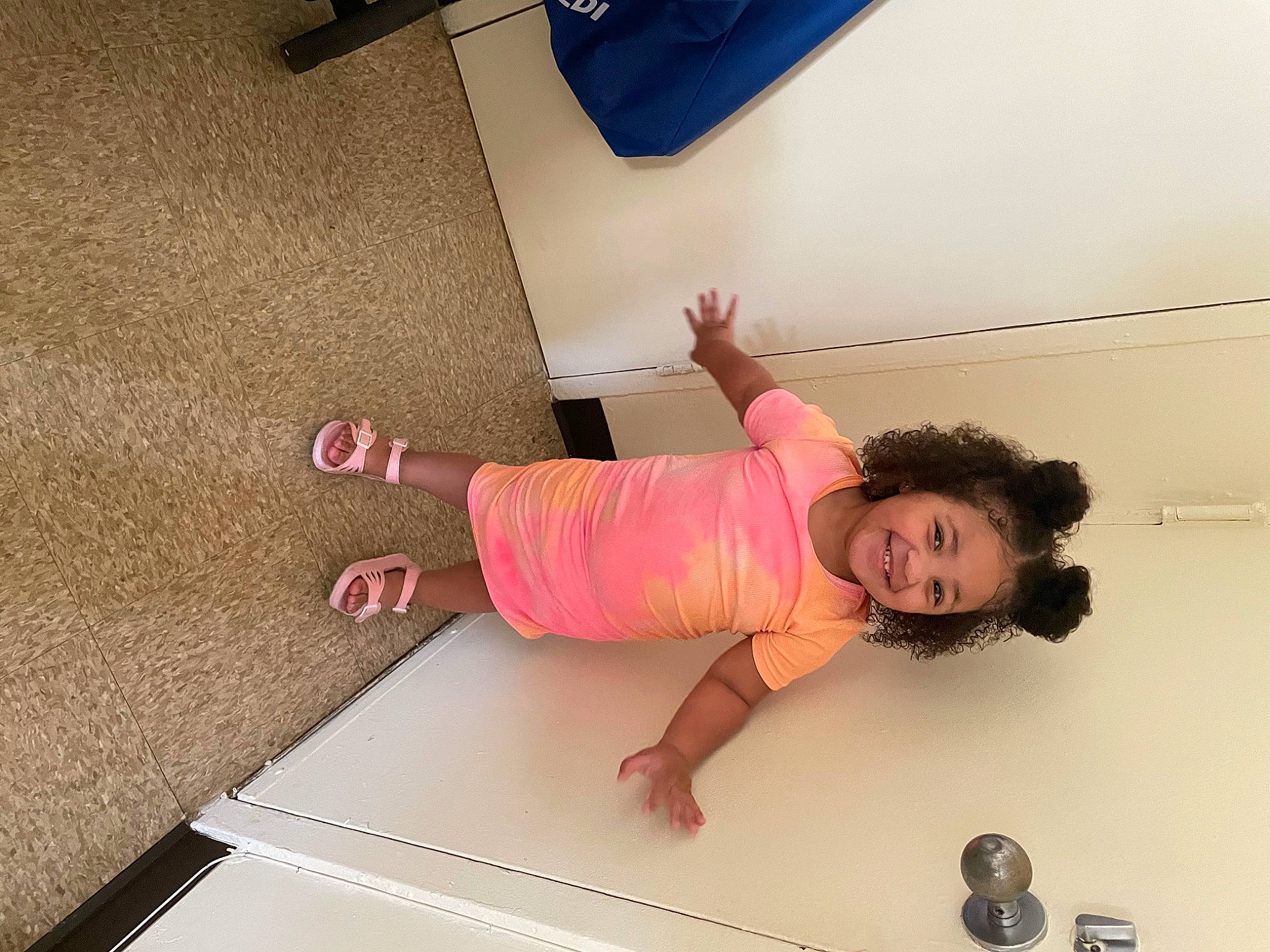 Lailani is registered to the contest to win money with this photo: baby_toddler_clothing, ceiling, child, comfort, floor, flooring, fun, hand, happy, hardwood, human_leg, joy, knee, leg, person, shoulder, t_shirt, thigh, toddler, wall