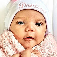 Denisse joined the competition — help win amazing prizes! baby, bodypart, bonnet, cap, clothing, face, finger, glove, hand, happy, hat, head, mouth, newborn, person, photography, portrait, sleeping, smile, towel