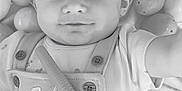 Sophia is registered to the contest to win money with this photo: baby, child, headband, smile, overalls, bunny_design, toy, playful, lying_down, closeup, monochrome, cute, infant, soft_texture, rounded_objects, adorable, portrait, toddler, hand, baby_clothes
