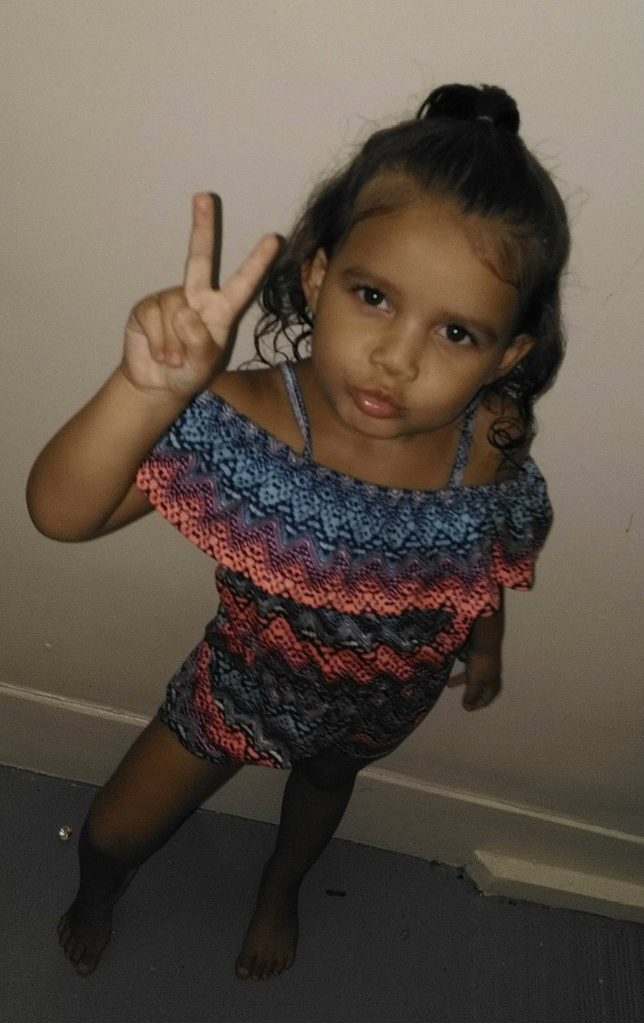 Jenaya is registered to the contest to win money with this photo: arm, beauty, cheek, child, dress, eye, finger, fun, gesture, hand, joint, leg, long_hair, person, photography, shoulder, sitting, skin, smile, thumb