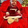 baby, blanket, chair, clothing, costume, couch, cushion, dress, face, furniture, head, homedecor, indoors, person, photography, plant, portrait, sitting, tree, velvet