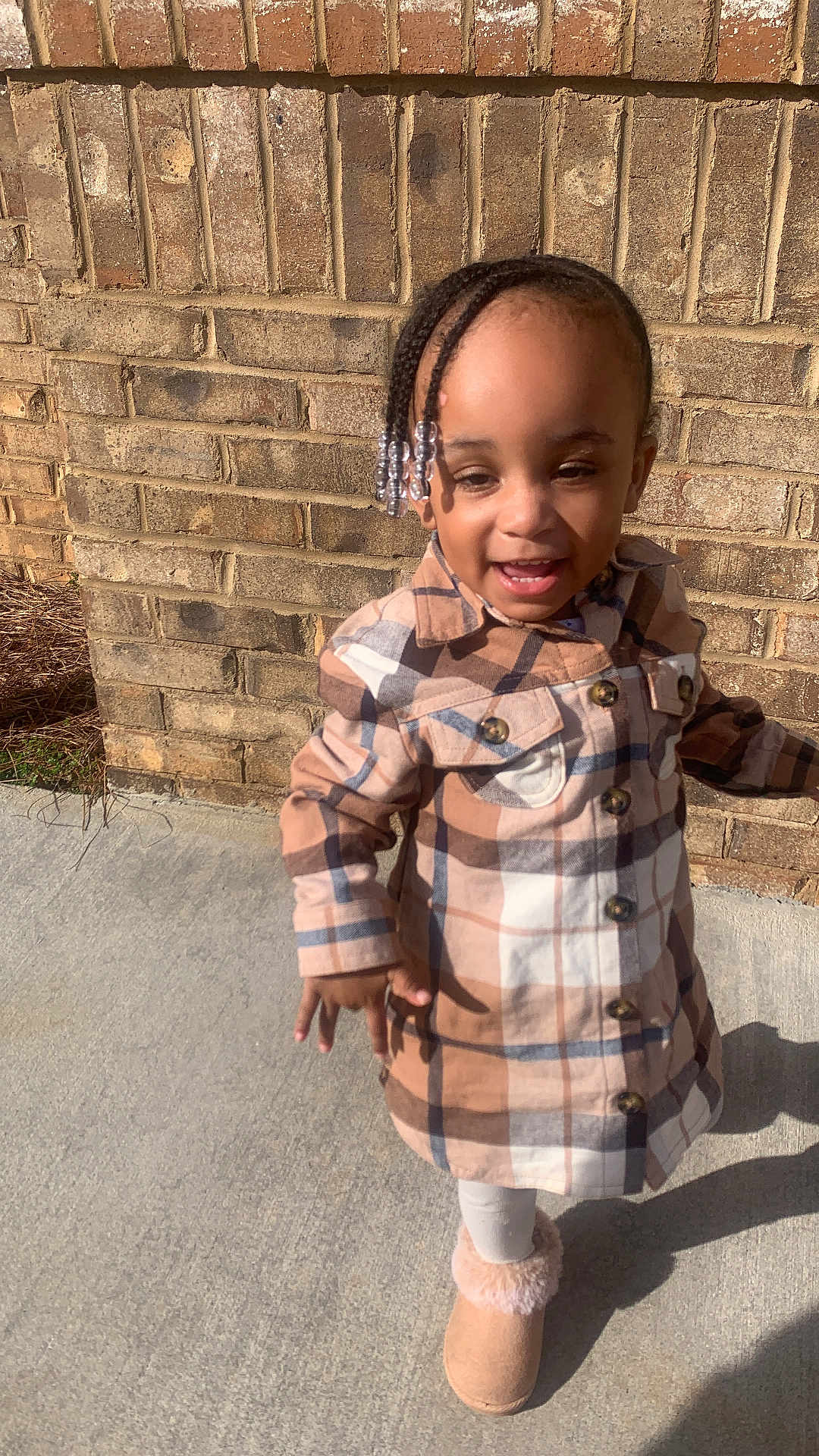 Nova joined the competition — help win amazing prizes! bodypart, brick, child, clothing, coat, dress, face, female, finger, girl, hand, happy, head, longsleeve, person, photography, portrait, sitting, sleeve, smile