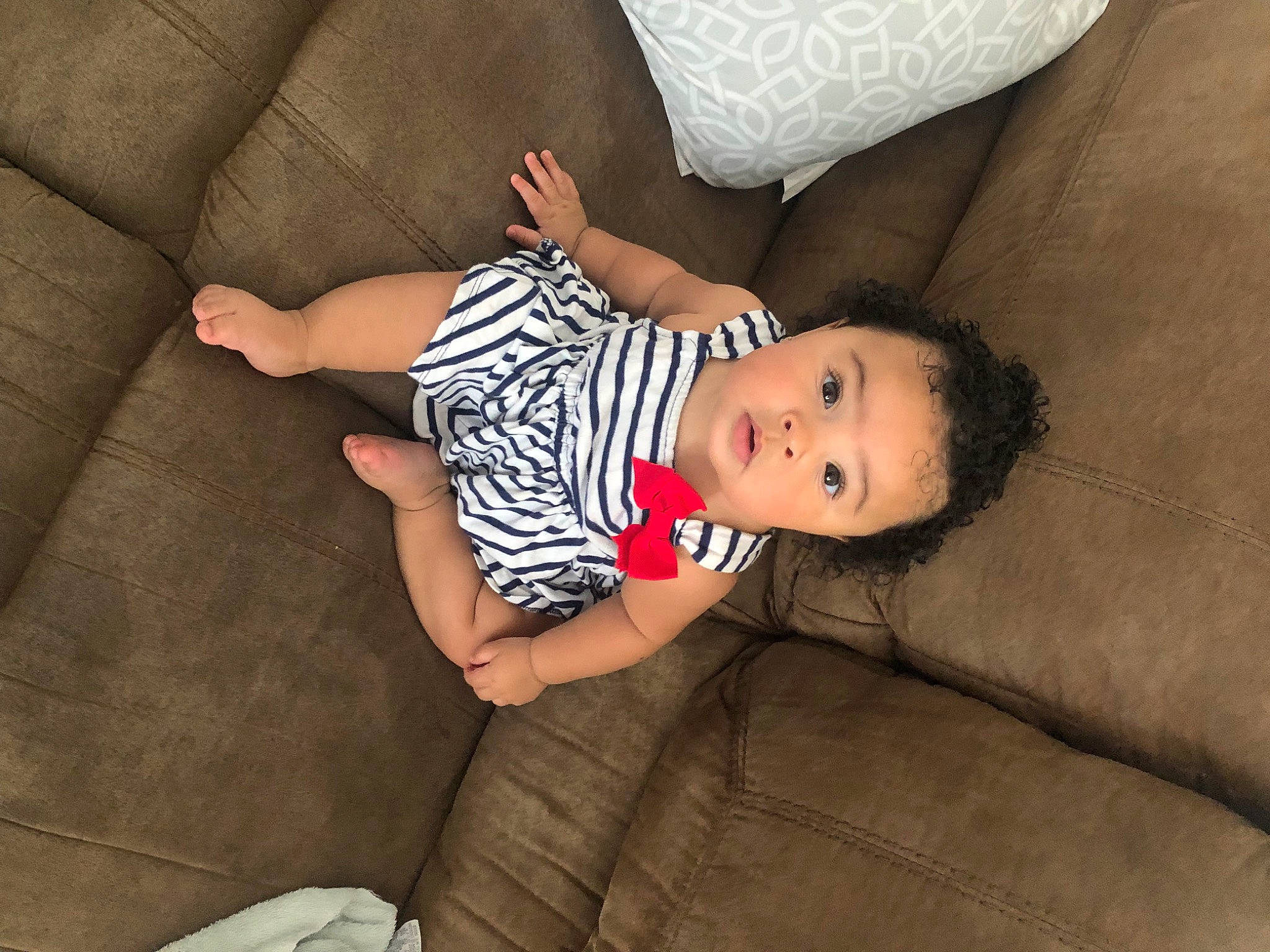Kennedi joined the competition — help win amazing prizes! arm, baby, baby_toddler_clothing, comfort, couch, elbow, eye, finger, flash_photography, furniture, head, human_leg, knee, leg, linens, person, skin, sleeve, surprise, thigh