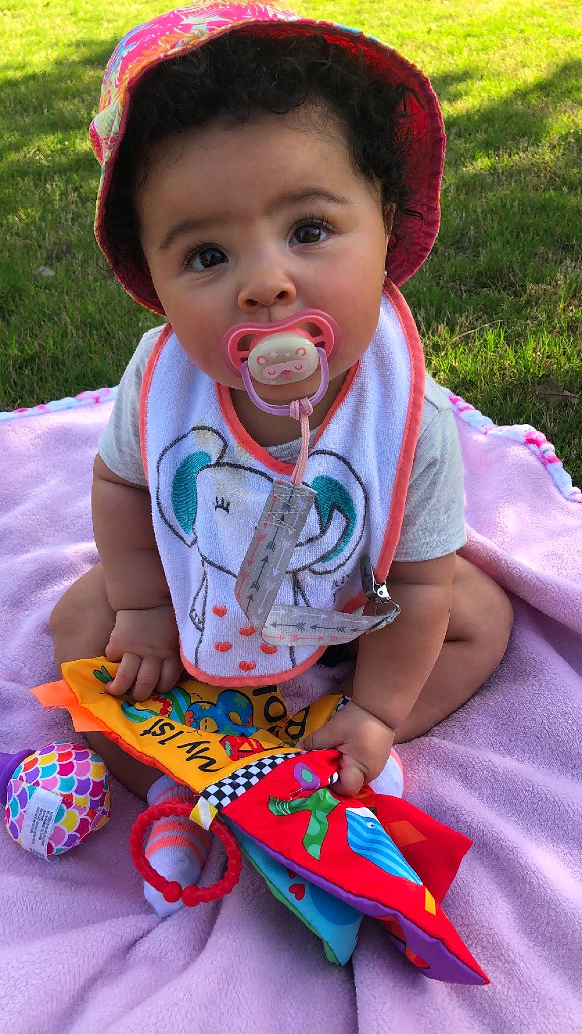 Kennedi is registered to the contest to win money with this photo: baby, baby_toddler_clothing, beauty, child, dress, facial_expression, grass, happy, iris, leisure, lip, mouth, person, pink, plant, recreation, red, skin, summer, t_shirt