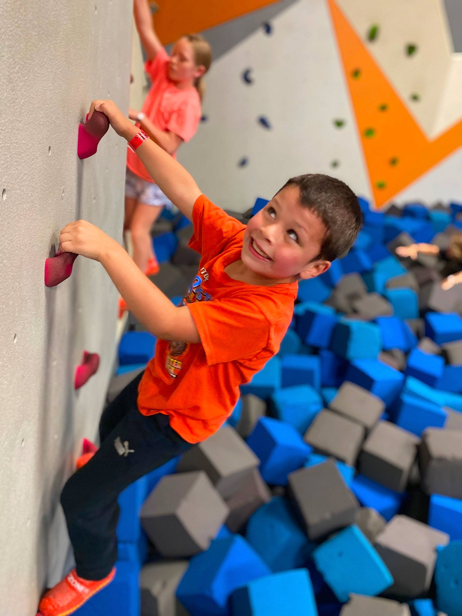Malikai is registered to the contest to win money with this photo: adventure, balance, blurred, climbing, climbing_harness, climbing_hold, competition, competition_event, elbow, electric_blue, fun, happy, joy, leisure, person, photograph, recreation, rock_climbing_equipment, rope, shorts