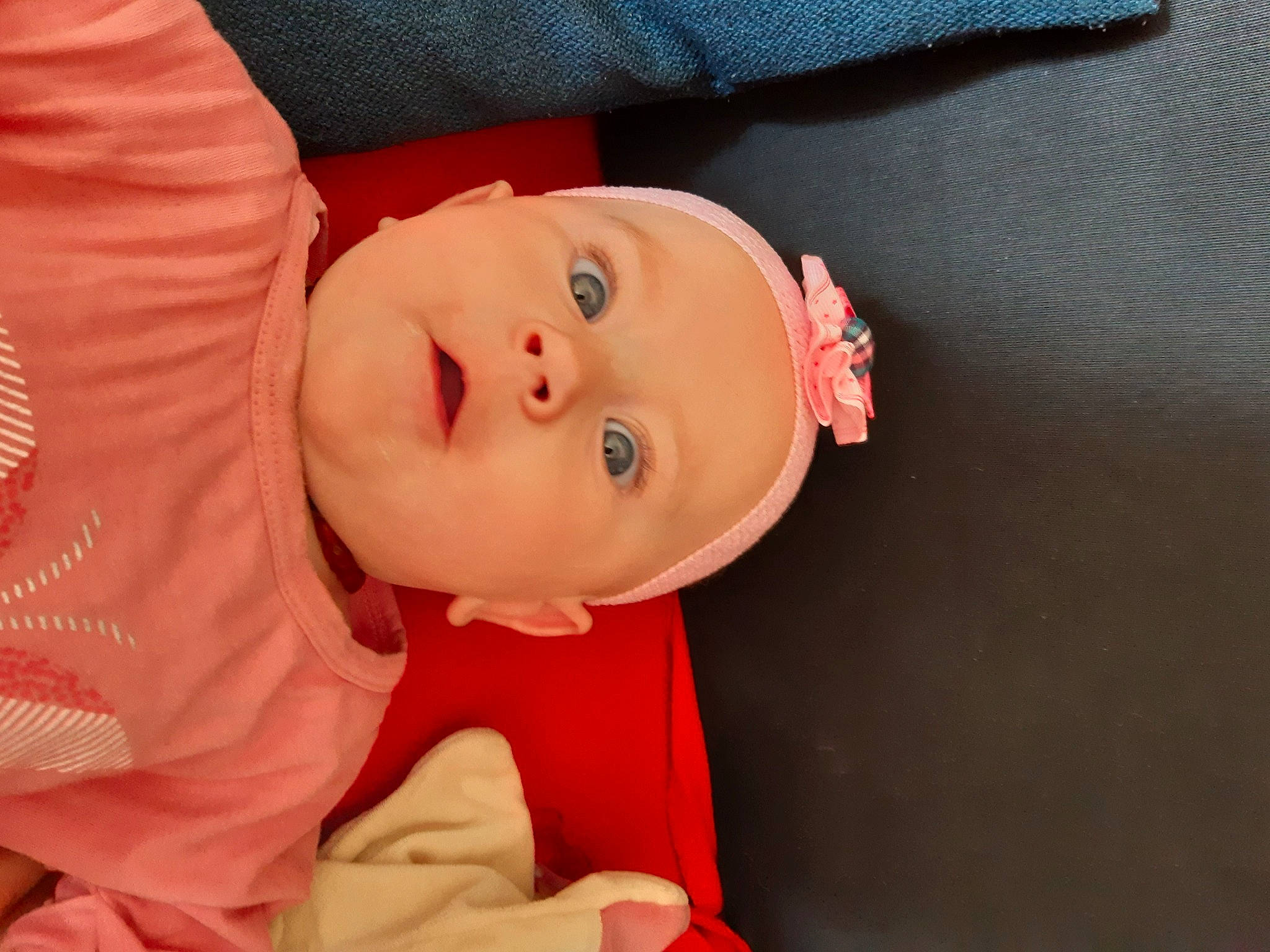 Abby participe au concours pour gagner de l'argent avec cette photo : baby, baby_products, baby_toddler_clothing, cheek, child, comfort, eyebrow, eyelash, happy, hat, human_body, iris, lip, nose, peach, person, pink, room, sleeve, smile