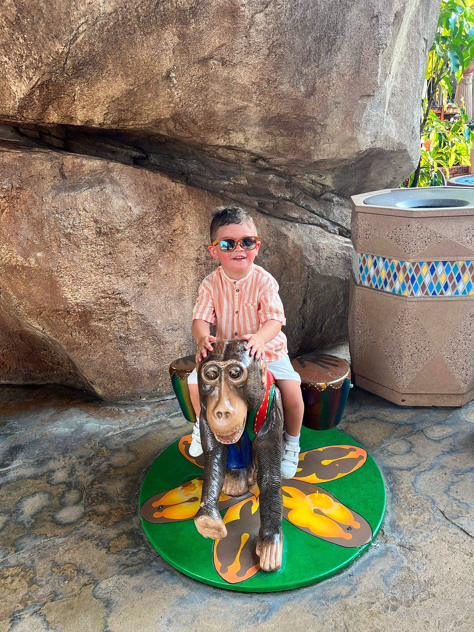 Francis Adam is registered to the contest to win money with this photo: art, bedrock, eyewear, fun, grass, joy, landscape, lawn_ornament, leisure, person, plant, recreation, rock, sculpture, sitting, soil, sunglasses, tourism, toy, trunk