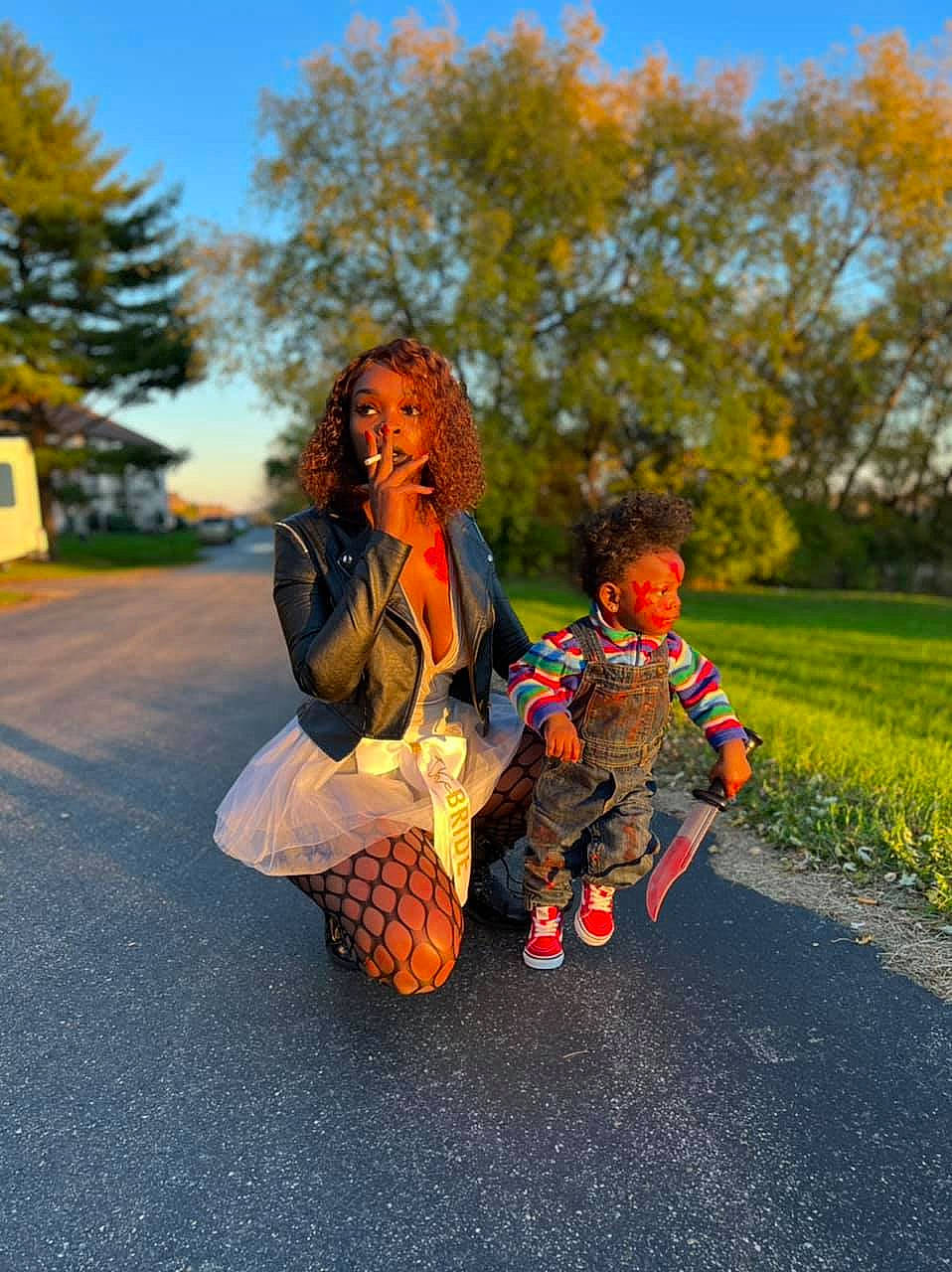 D'Ozzyae joined the competition — help win amazing prizes! asphalt, boot, fun, grass, happy, landscape, leisure, people_in_nature, person, plaid, plant, recreation, road, road_surface, shoe, sitting, sky, toddler, toy, tree