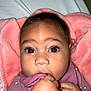Zaileigh is registered to the contest to win money with this photo: baby, infant, face, hand, blanket, clothing, pink, purple, cute, closeup, child, eyes, skin, indoor, portrait, young, person, soft, cozy, sleepwear