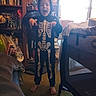 Sebastian joined the competition — help win amazing prizes! child, skeleton_costume, halloween, costume, barefoot, standing, smiling, open_mouth, indoors, bedroom, bookshelf, books, fan, playpen, furniture, carpet, window, backlighting, portrait, playful