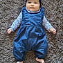 baby, blue, carpet, child, clothing, cute, denim, fabric, face, foot, hand, headband, indoor, infant, lying_down, polka_dot, portrait, romper, smile, soft_texture