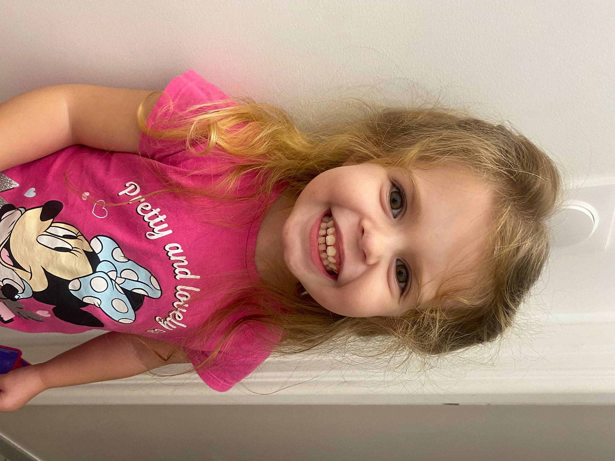 Calie a rejoint le concours — aidez-le/la à gagner de superbes lots ! baby_toddler_clothing, blond, brown_hair, cheek, child, child_model, eyelash, flooring, fun, happy, joy, lip, magenta, person, portrait_photography, room, skin, sleeve, smile, toddler