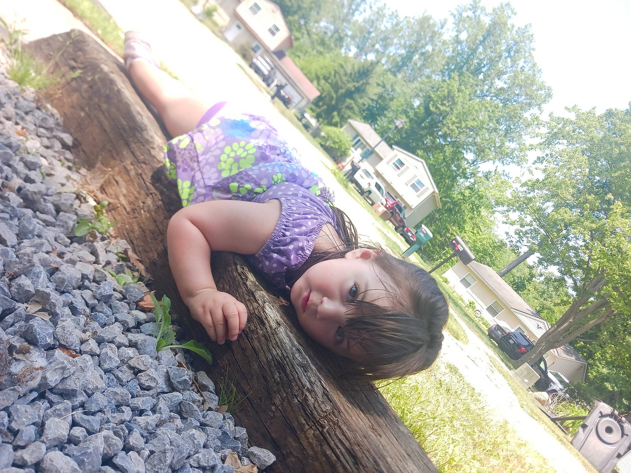 Anastasia is registered to the contest to win money with this photo: blond, eyewear, fun, grass, happy, human_leg, landscape, leisure, long_hair, people_in_nature, person, plant, recreation, sitting, soil, thigh, tire, travel, tree, vacation