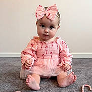 Genevieve joined the competition — help win amazing prizes! adorable, baby, bow, candy_cane, carpet, child, clothing, cute, floor, headband, holiday_theme, indoor, infant, looking_at_camera, person, pink_dress, portrait, sitting, toes, young_child