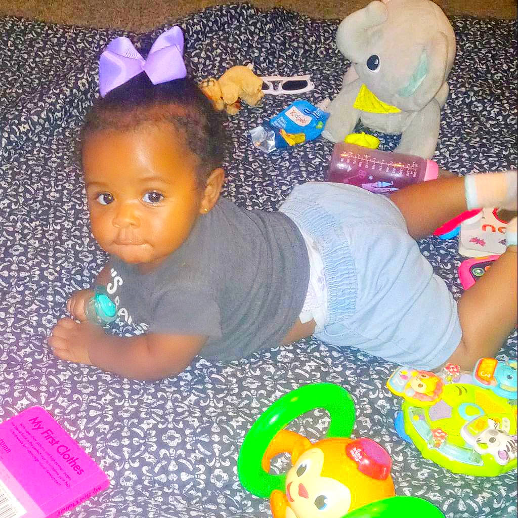 Nyla Oshun is registered to the contest to win money with this photo: baby, baby_toddler_clothing, blue, cheek, child, doll, eyelash, fun, organ, people, person, pink, product, purple, skin, snapshot, textile, toddler, toy, violet