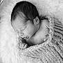 Miguel joined the competition — help win amazing prizes! newborn, baby, sleeping, blanket, knitted, basket, cozy, soft, black_and_white, infant, cute, portrait, close_up, peaceful, wrapped, child, resting, texture, homedecor, toddler