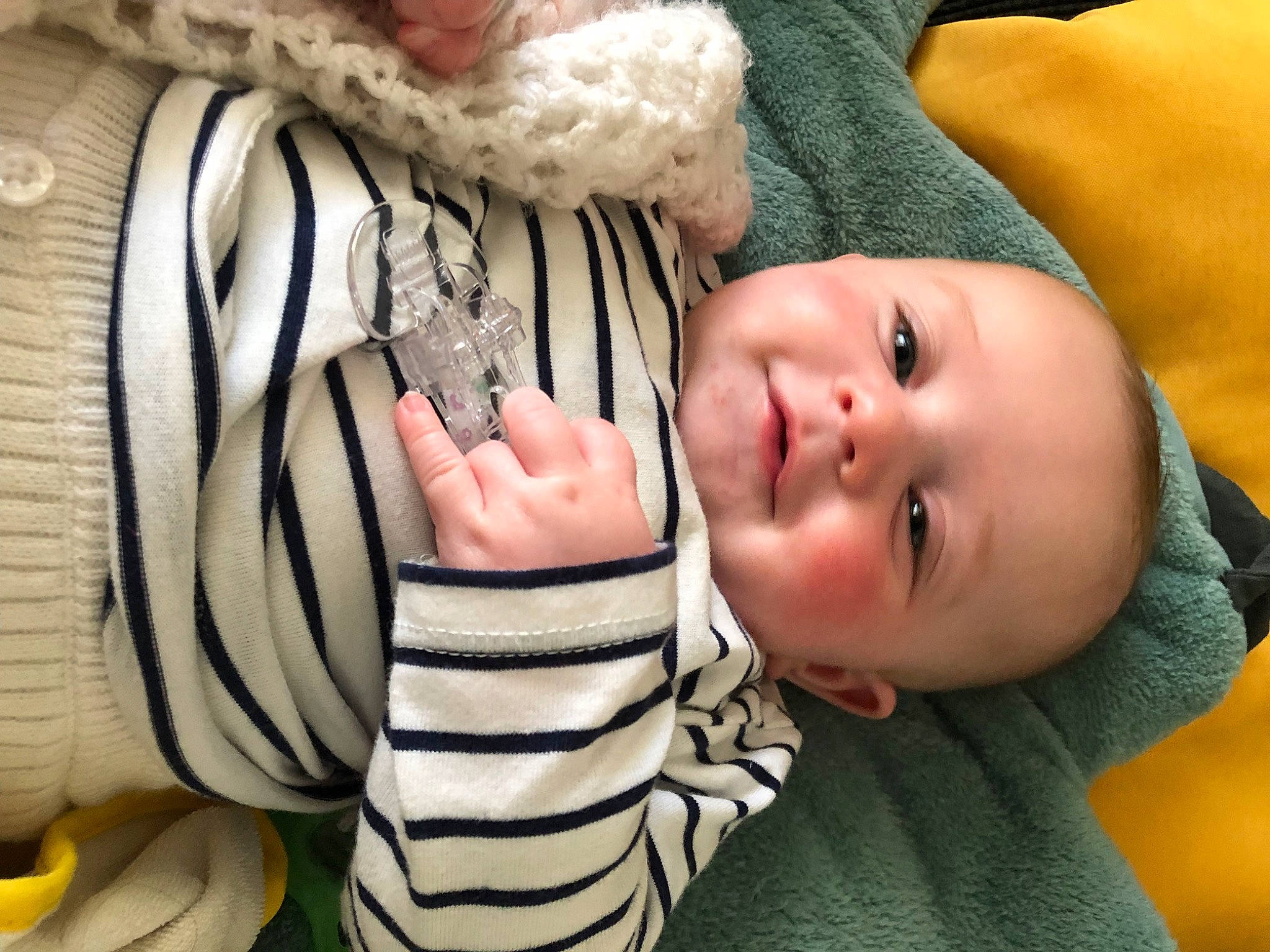 Lola participe au concours pour gagner de l'argent avec cette photo : arm, baby_toddler_clothing, cheek, comfort, eye, eyelash, facial_expression, finger, gesture, hand, happy, head, headgear, mammal, mouth, nose, outerwear, person, skin, sleeve