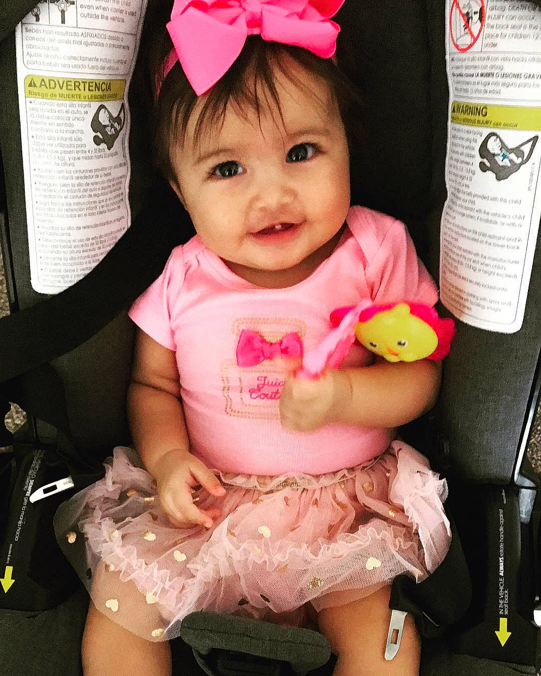 Raina is registered to the contest to win money with this photo: arm, baby_products, child, day, girl, hair_accessory, infant, person, pink, product, toddler