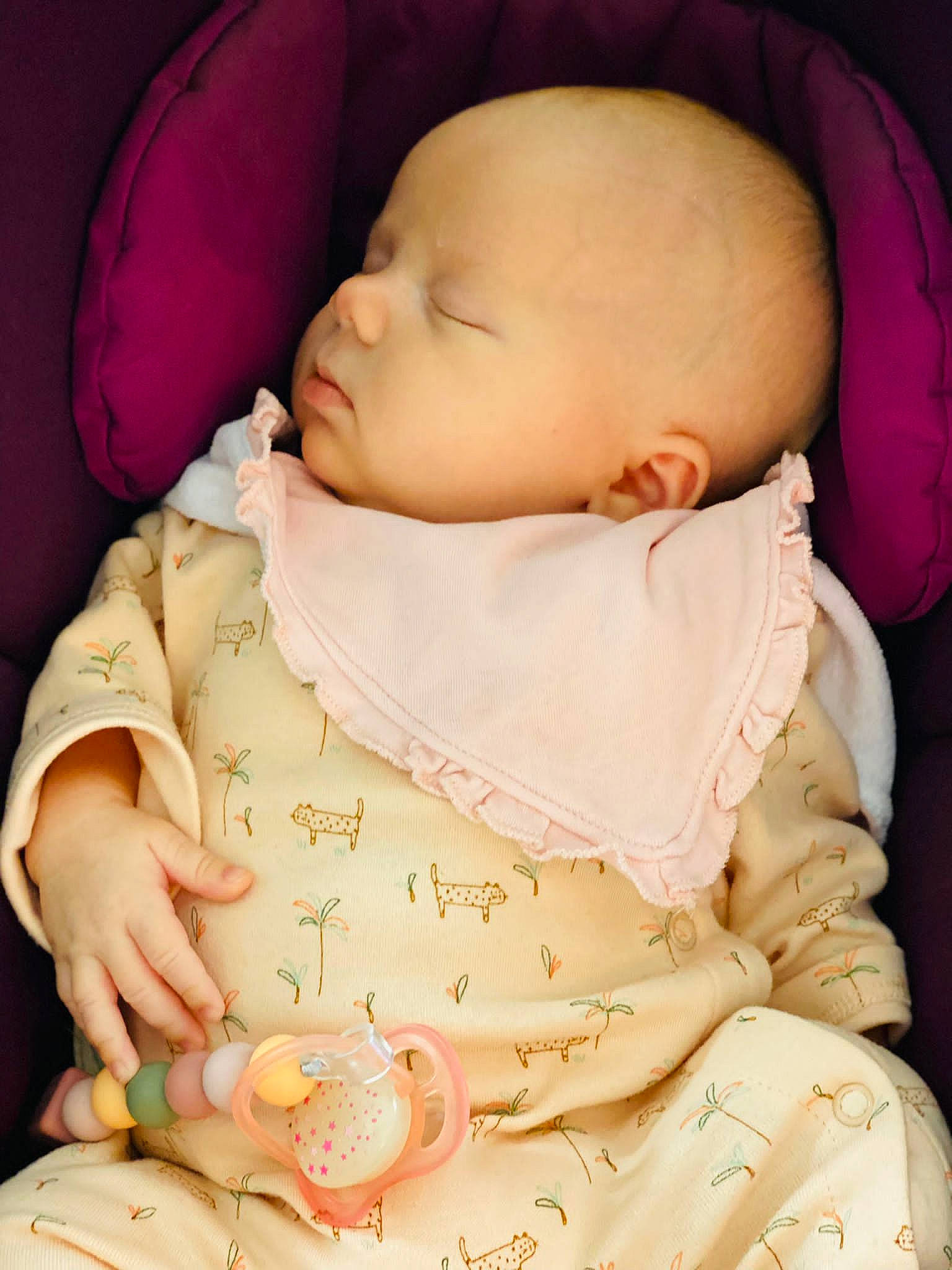 Lily participe au concours pour gagner de l'argent avec cette photo : baby, baby_sleeping, baby_toddler_clothing, cheek, comfort, finger, hand, human_body, lip, mouth, neck, nose, orange, person, pink, product, skin, sleeve, textile, toddler