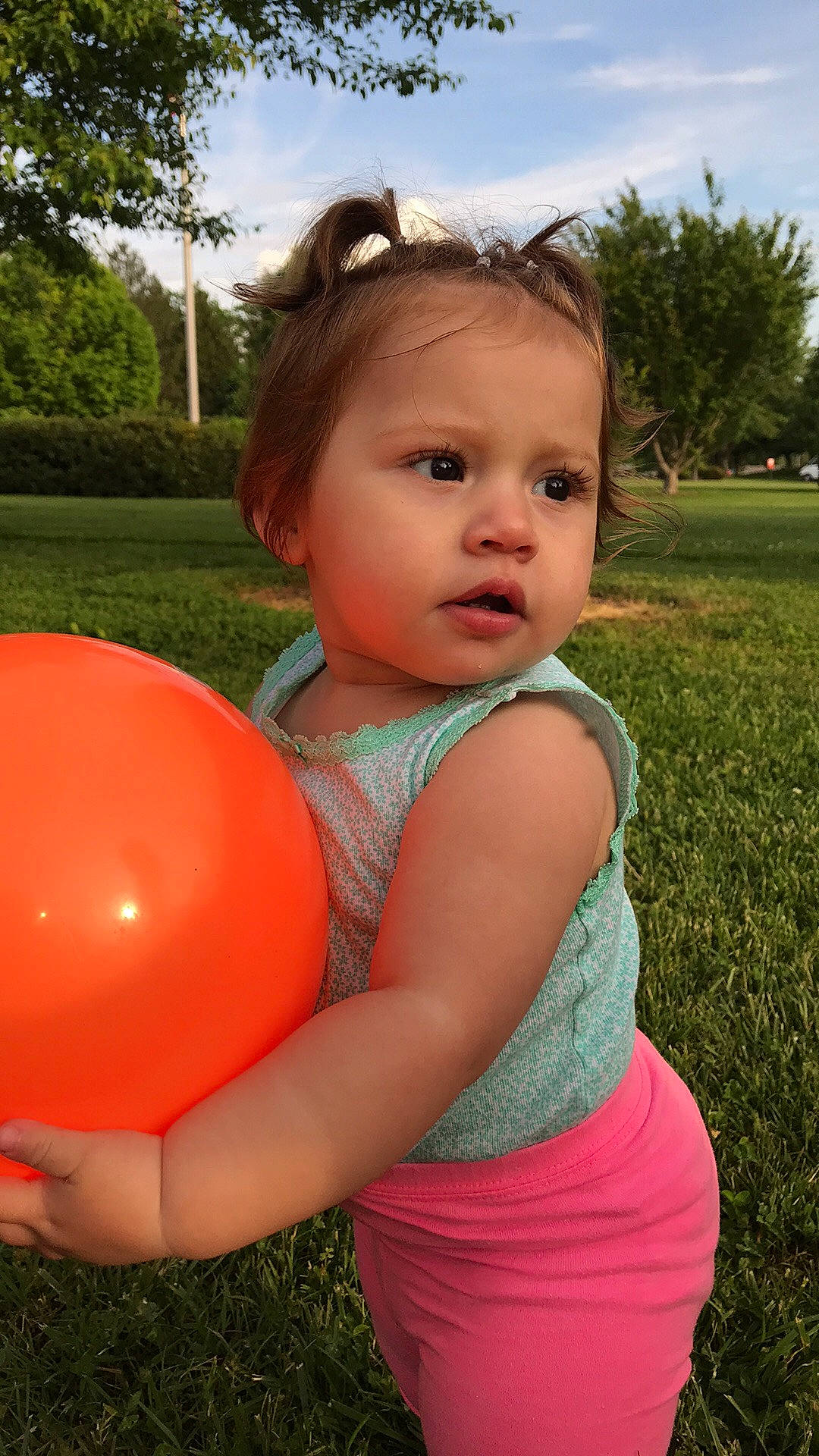 Emberley joined the competition — help win amazing prizes! baby, balloon, child, grass, party_supply, person, pink, play, summer, toddler