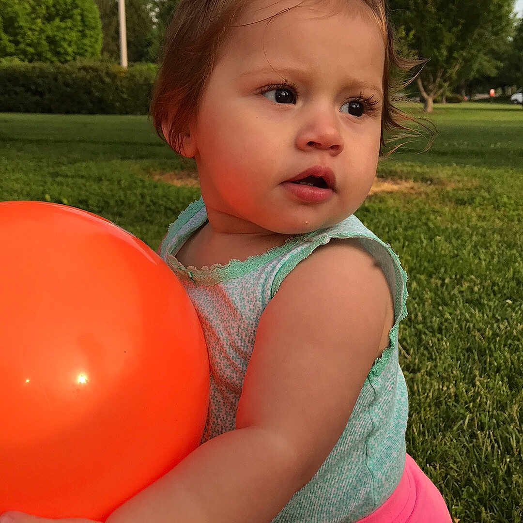 Emberley joined the competition — help win amazing prizes! baby, balloon, child, grass, party_supply, person, pink, play, summer, toddler