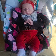 Lily joined the competition — help win amazing prizes! baby, infant, sleeping, baby_rocker, blanket, headband, red_pants, white_socks, floor_tile, indoor, baby_clothes, animal_print, palm_tree, toy_pattern, cozy, peaceful, child, resting, cute, nap