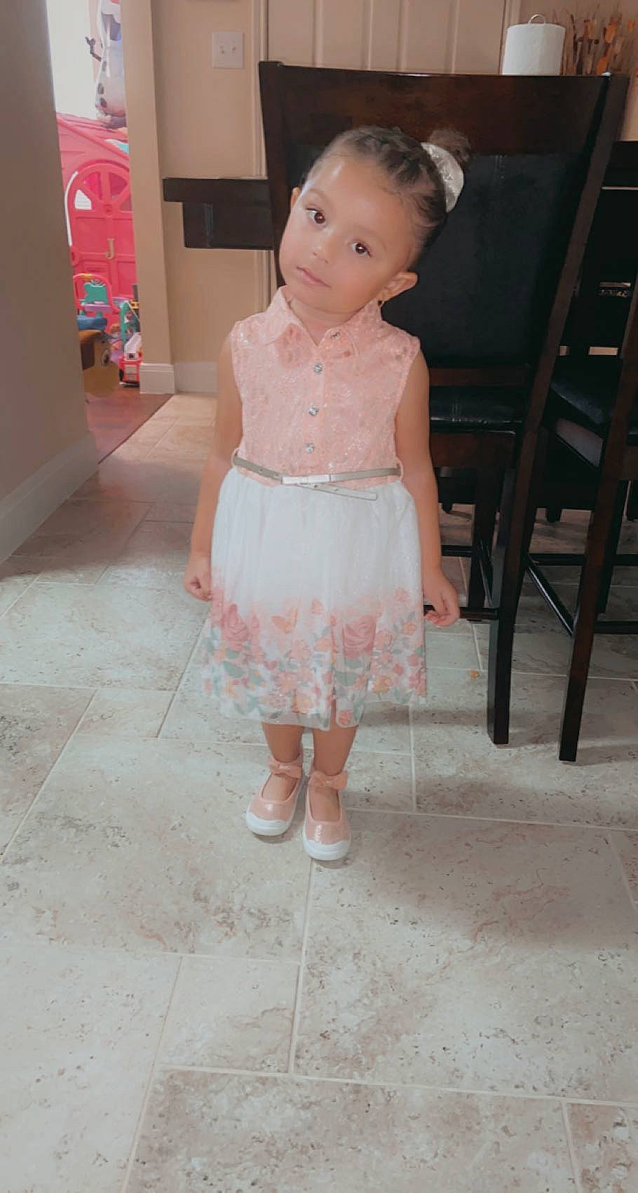 Jerzi is registered to the contest to win money with this photo: baby_toddler_clothing, chair, day_dress, dress, embellishment, eye, face, fashion_design, floor, flooring, hair, happy, leg, one_piece_garment, person, pink, skin, sleeve, toddler, waist