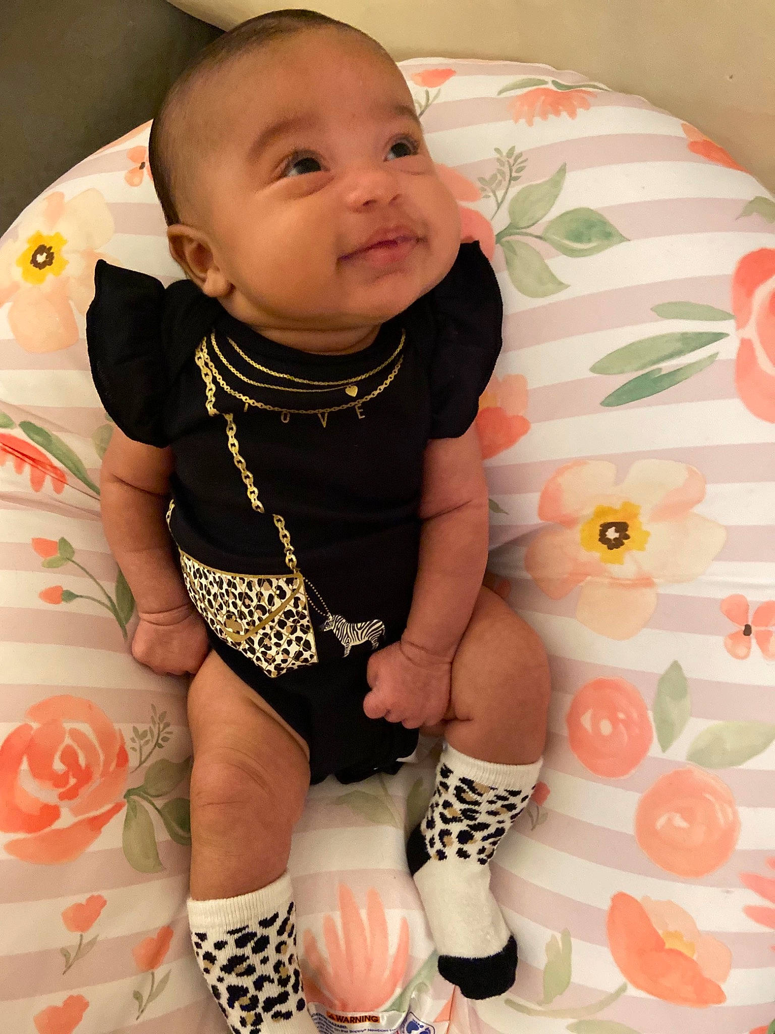 Reymani is registered to the contest to win money with this photo: arm, baby, baby_toddler_clothing, comfort, finger, hairstyle, happy, head, leg, neck, person, pink, shorts, skin, sleeve, smile, t_shirt, textile, thigh, toddler