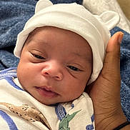 Mickayel joined the competition — help win amazing prizes! baby, newborn, infant, hat, hand, blanket, onesie, dinosaur, cute, sleepy, closeup, portrait, child, soft, resting, warmth, tenderness, person, headwear, cozy