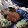 Ezekiel is registered to the contest to win money with this photo: newborn, baby, sleeping, mittens, blanket, soft, cozy, infant, clothing, face, peaceful, closeup, bed, resting, person, cute, hair, skin, indoors, comfort