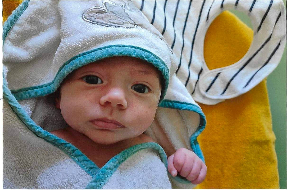 Gabriel participe au concours pour gagner de l'argent avec cette photo : baby, baby_products, baby_sleeping, baby_toddler_clothing, beanie, cap, cheek, child, comfort, fashion_accessory, happy, headgear, headwear, knit_cap, linens, person, photograph, skin, sleeve, textile