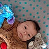 Ezyo participe au concours pour gagner de l'argent avec cette photo : baby, bed, bedding, blanket, blue_toy, child, comfort, cozy, cute, expression, face, indoors, infant, lying_down, plush_toy, polka_dot, portrait, reindeer, soft_toy, stuffed_animal