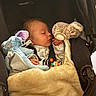 baby, blanket, car_seat, child, closeup, clothing, comfort, cozy, cute, face, hand, indoors, infant, peaceful, plush_toy, portrait, rest, sleeping, soft_toys, stroller