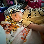 Brynleigh joined the competition — help win amazing prizes! baby, blanket, animal_print, headband, yellow_clothing, indoor, person, face, infant, lying_down, soft_texture, tiger_print, cozy, couch, home, child, cute, patterned, resting, casual