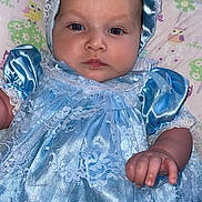 Brynleigh is registered to the contest to win money with this photo: baby, blue_dress, bonnet, child, clothing, cute, expressionless, fabric, face, hand, indoor, infant, lace, lying_down, newborn, owl_pattern, person, pillow, portrait, soft