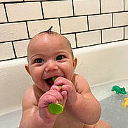 Apollo James Menton joined the competition — help win amazing prizes! baby, bathing, bathtub, biting, bodypart, eating, face, finger, food, hand, happy, head, mouth, person, photography, pool, portrait, smile, teeth, tub