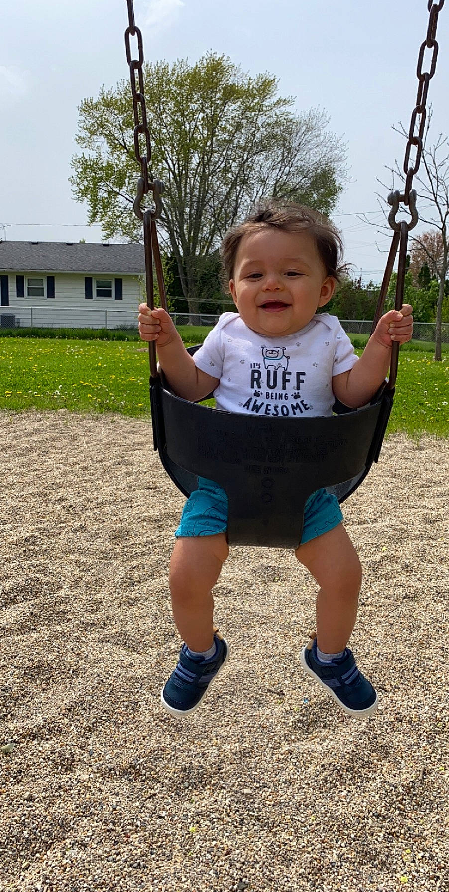 León is registered to the contest to win money with this photo: child, fun, human_settlement, outdoor_play_equipment, person, play, playground, public_space, recreation, smile, swing, toddler