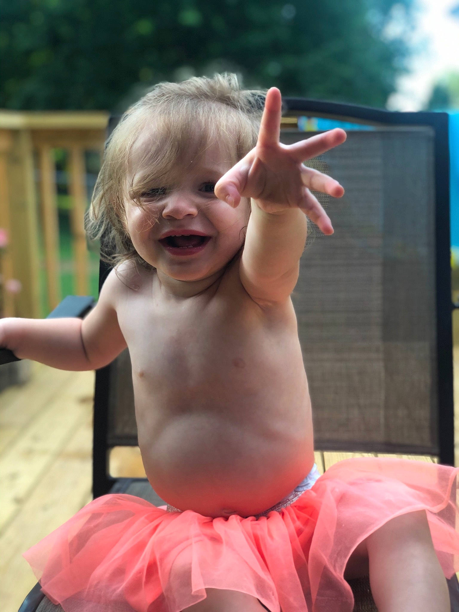 Madalynn is registered to the contest to win money with this photo: baby, ballet_tutu, blond, child, costume, finger, fun, gesture, hand, happy, leisure, person, pink, play, smile, summer, thumb, toddler, vacation, water