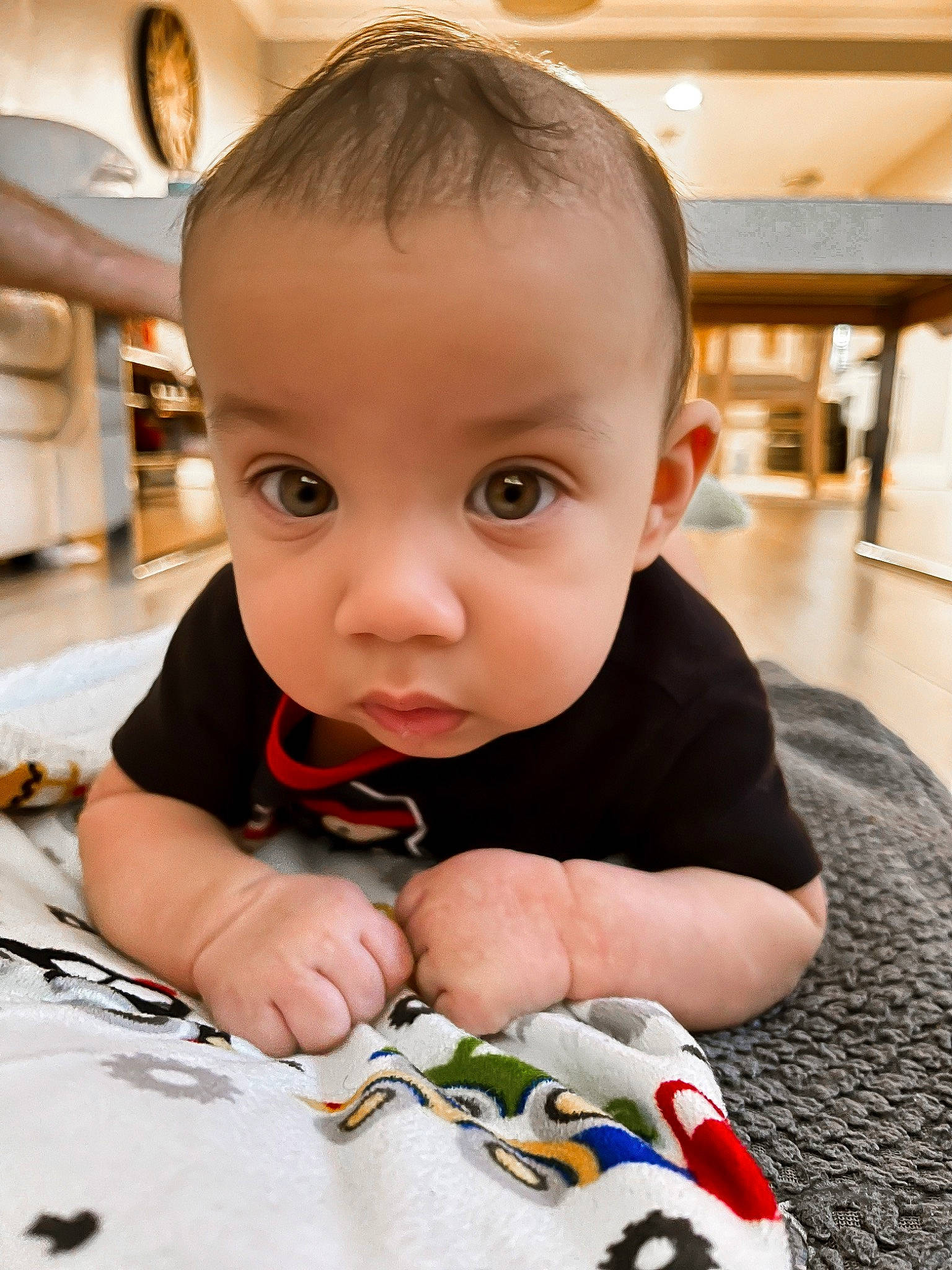 Creed is registered to the contest to win money with this photo: baby, baby_toddler_clothing, carmine, cheek, child, floor, flooring, fun, happy, nail, pattern, person, play, room, sitting, skin, sock, thumb, toddler, vacation