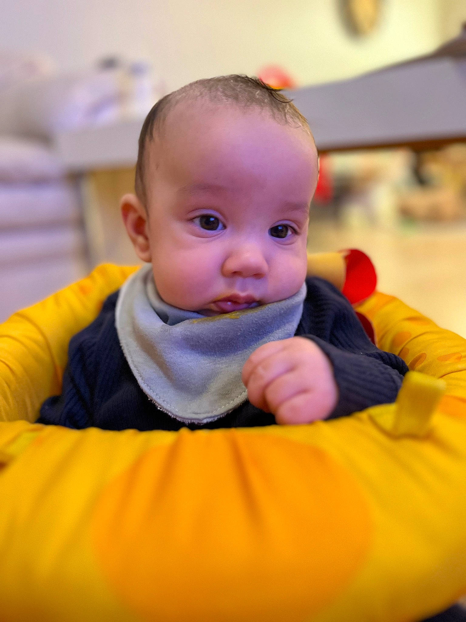 Creed is registered to the contest to win money with this photo: baby, baby_products, baby_toddler_clothing, cheek, child, comfort, flash_photography, flooring, fun, happy, leisure, nose, orange, person, portrait_photography, room, sitting, skin, smile, toddler