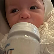 Leonardo joined the competition — help win amazing prizes! baby, infant, bottle, milk, feeding, blanket, close_up, face, eyes, white, cozy, cute, newborn, portrait, child, soft, warm, young, person, indoors