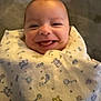 Leonardo joined the competition — help win amazing prizes! baby, smile, tongue, blanket, pattern, wrapped, infant, cute, happy, face, head, cozy, child, soft, young, indoors, portrait, person, warm, comfort