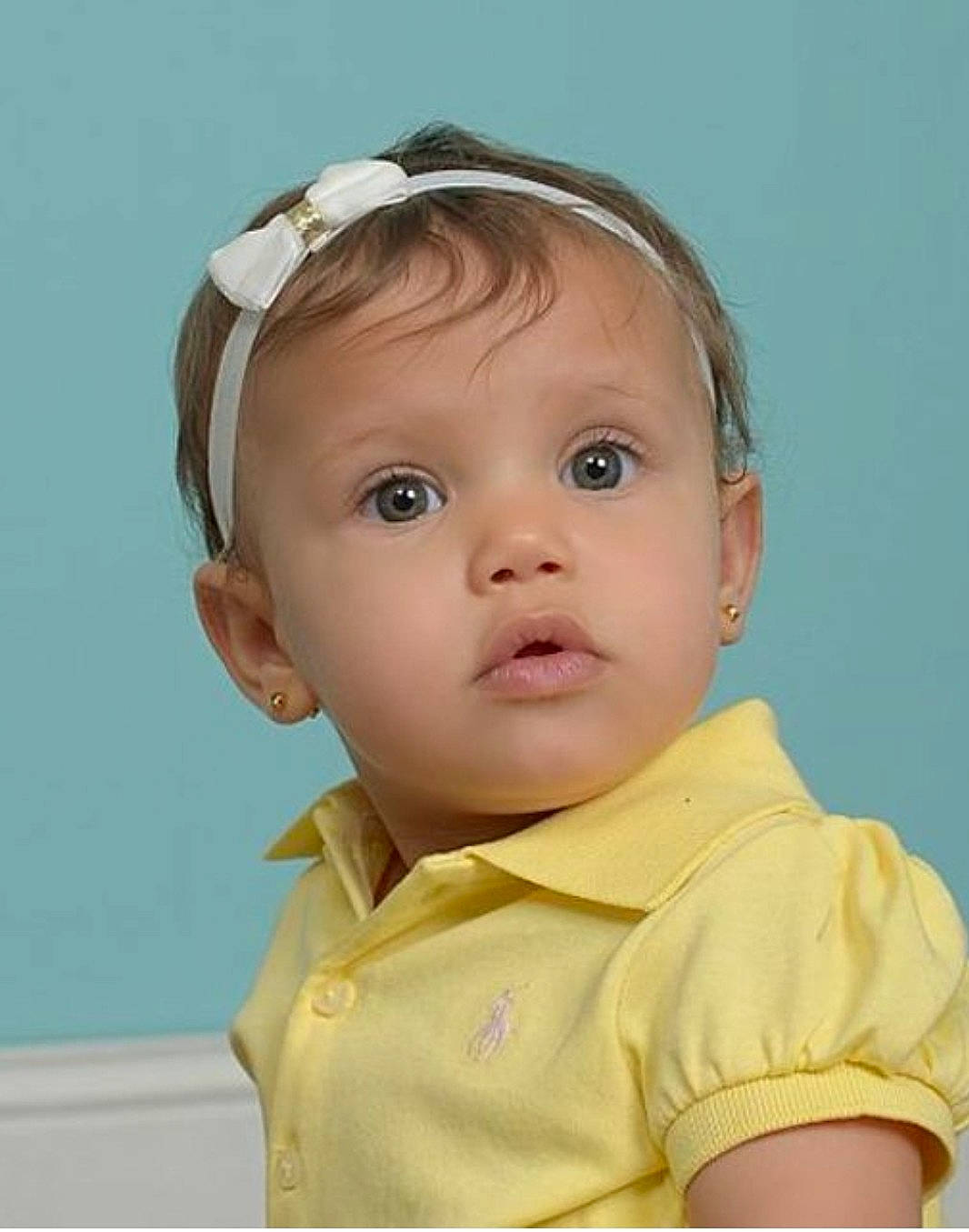 Aspen is registered to the contest to win money with this photo: cheek, child, child_model, chin, ear, eye, face, forehead, girl, hair_accessory, head, infant, nose, person, skin, surprise, toddler